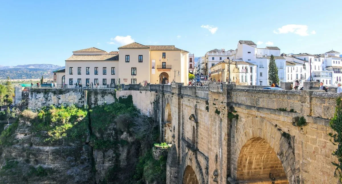 Puente Nuevo in Ronda spanning the Tajo gorge, with the white houses of the town behind it